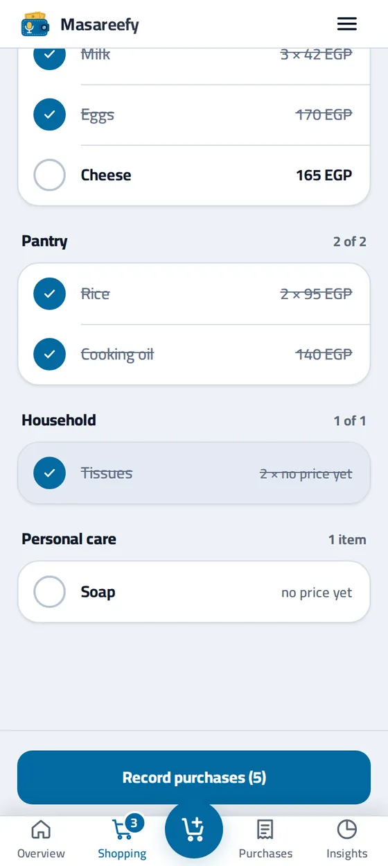 The shopping list mid-shop in the Masareefy app: three items in the basket and the Record purchases button
